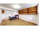 Cozy bedroom in basement with built-in shelving and closet at 7559 Jay Ct, Arvada, CO 80003