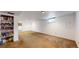 Basement area with carpeted floors and shelves for storage at 7559 Jay Ct, Arvada, CO 80003