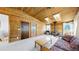 Living room features a wood ceiling, carpet, and a wood burning stove at 7559 Jay Ct, Arvada, CO 80003