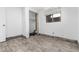 Unfinished basement featuring an unfinished closet with storage and a window for natural light at 8757 Estes Ct, Arvada, CO 80005