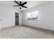 Bedroom with neutral carpeting, ceiling fan, and closet at 8757 Estes Ct, Arvada, CO 80005