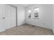 Bedroom with neutral carpeting and a closet at 8757 Estes Ct, Arvada, CO 80005