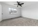 Bedroom with neutral carpeting and a ceiling fan at 8757 Estes Ct, Arvada, CO 80005