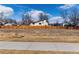 View of the property backing to a greenbelt and stream for added privacy at 8757 Estes Ct, Arvada, CO 80005