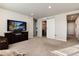 Spacious bonus room featuring a large TV and comfortable seating at 6612 Merrimack Dr, Castle Pines, CO 80108