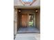 Close-up of the front door with brick landing, and visible address at 2630 Juniper Ave # 37-5, Boulder, CO 80304