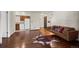 Open-concept living area featuring hardwood floors, a couch and access to kitchen at 2630 Juniper Ave # 37-5, Boulder, CO 80304