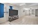 Bright basement Gathering room with recessed lighting, large television, and built-in shelving at 4220 E 119Th Pl # A, Thornton, CO 80233