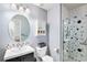 Bright bathroom with patterned shower, a modern vanity, and coordinated decor at 4220 E 119Th Pl # A, Thornton, CO 80233