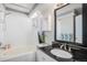 Well-lit bathroom featuring granite counters, tub, shower, and fixtures at 4220 E 119Th Pl # A, Thornton, CO 80233