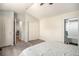 Well-lit bedroom featuring a ceiling fan, multiple closets, and an adjacent bathroom offering convenience and functionality at 4220 E 119Th Pl # A, Thornton, CO 80233