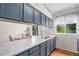 Modern kitchen with stainless steel appliances, painted cabinets, and a large window with views at 4220 E 119Th Pl # A, Thornton, CO 80233