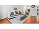 Bright living area with hardwood floors, comfortable seating, and a dining area, perfect for relaxing or entertaining at 4220 E 119Th Pl # A, Thornton, CO 80233
