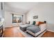 Bright living room featuring a large window, comfortable seating, and hardwood floors at 4220 E 119Th Pl # A, Thornton, CO 80233