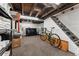 Unfinished basement with washer, dryer, storage shelves, and stairs to the upper level at 3059 N Humboldt St, Denver, CO 80205