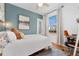 Bright bedroom featuring a ceiling fan, lots of light, and space for a desk for office use at 3059 N Humboldt St, Denver, CO 80205
