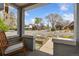 Inviting front porch with brick pillars and a view of a tree-lined street and raised garden beds at 3059 N Humboldt St, Denver, CO 80205