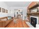 Spacious living room with hardwood floors, fireplace, and seamless flow into other living spaces at 3059 N Humboldt St, Denver, CO 80205