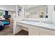 Bright bathroom featuring a vanity, a mirror, a toilet, and a shower with a blue curtain at 3832 S Quebec St, Denver, CO 80237