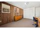 Comfortable bedroom features wood paneling, neutral carpet, and ample closet space at 3832 S Quebec St, Denver, CO 80237