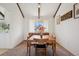 Inviting dining room featuring exposed beams and large window that provides lots of natural light at 3832 S Quebec St, Denver, CO 80237