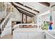 Bright kitchen featuring wooden ceiling beams and an open layout at 3832 S Quebec St, Denver, CO 80237