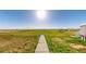 Large backyard with a sidewalk leading to open space at 66095 E Kettle Pl, Byers, CO 80103