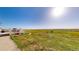 Spacious backyard features a lawn and deck, perfect for outdoor living at 66095 E Kettle Pl, Byers, CO 80103