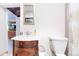 Bathroom features a vanity with marble countertop and matching mirror, adjacent to a toilet and shower at 66095 E Kettle Pl, Byers, CO 80103