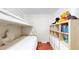 Cozy bedroom with white bunkbeds and cubby storage, ideal for space-saving and belongings at 66095 E Kettle Pl, Byers, CO 80103