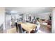 Spacious dining area adjacent to living room, perfect for entertaining and gatherings at 66095 E Kettle Pl, Byers, CO 80103