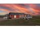 Charming single-story home with a welcoming front porch and vibrant exterior paint at 66095 E Kettle Pl, Byers, CO 80103