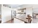 Bright kitchen with stainless steel appliances, ample storage, and island with bar stools at 66095 E Kettle Pl, Byers, CO 80103