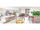 Bright, open-plan living room with hardwood floors and comfortable seating at 66095 E Kettle Pl, Byers, CO 80103