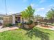 Backyard with patio, glass doors, a colorful rug, and a beautiful garden at 4163 S Decatur St, Englewood, CO 80110