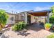 Charming backyard features a brick patio, covered sitting area, and lush greenery at 4163 S Decatur St, Englewood, CO 80110
