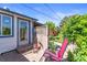 Relaxing patio area with lush landscaping, and a tool shed in the backyard at 4163 S Decatur St, Englewood, CO 80110