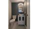 Charming bathroom featuring modern fixtures, a stylish sink, and a sleek, space-saving design at 4163 S Decatur St, Englewood, CO 80110