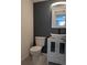 Modern bathroom featuring a stylish white vanity, sleek faucet, and contemporary design at 4163 S Decatur St, Englewood, CO 80110