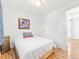 Neutral bedroom with painted accent wall and hardwood floors at 4163 S Decatur St, Englewood, CO 80110