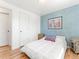 Nicely decorated bedroom with an accent wall, hardwood floors, and natural light at 4163 S Decatur St, Englewood, CO 80110