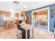 Bright kitchen features stainless steel appliances and an adjacent dining area with backyard access at 4163 S Decatur St, Englewood, CO 80110