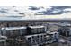 An aerial view of the residential area with building exteriors, roadways and distant mountains at 2870 W Parkside Pl, Denver, CO 80221