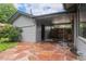 Covered patio area with flagstone flooring, offering outdoor living space at 1694 S Elm St, Denver, CO 80222