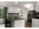 Modern kitchen featuring sleek countertops, stainless steel appliances, and ample cabinet space at 1694 S Elm St, Denver, CO 80222