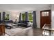 Inviting living room with comfortable seating and views of the outdoors from large windows at 1694 S Elm St, Denver, CO 80222