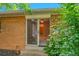 View of backyard through a sliding glass door at 2682 S Benton St, Lakewood, CO 80227