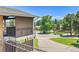 Balcony with views of neighborhood street and surrounding trees and houses at 2682 S Benton St, Lakewood, CO 80227