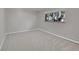 Neutral bedroom with carpet flooring and view to the tree-lined exterior at 2682 S Benton St, Lakewood, CO 80227