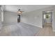 Spacious living room with carpet flooring, neutral colors, and ample natural light at 2682 S Benton St, Lakewood, CO 80227